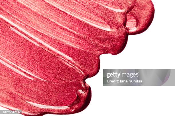 red glitter lipstick texture on white background isolated. lip gloss, nail polish smear. products for makeup and skin care. beauty cosmetics. cosmetology. closeup. - verniz-para-unhas imagens e fotografias de stock