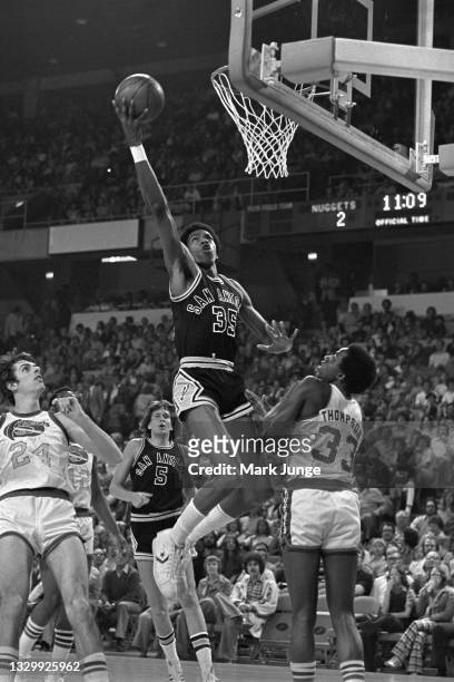 San Antonio Spurs forward Larry Kenon soars for a layup during an NBA basketball game at McNichols Arena on March 23, 1977 in Denver, Colorado. :...