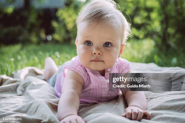 portrait of a cute baby girl outdoor. - weibliches baby stock-fotos und bilder