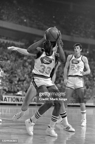 Denver Nuggets forward David Thompson prepares for a turnaround jump shot during an NBA basketball game against the San Antonio Spurs at McNichols...