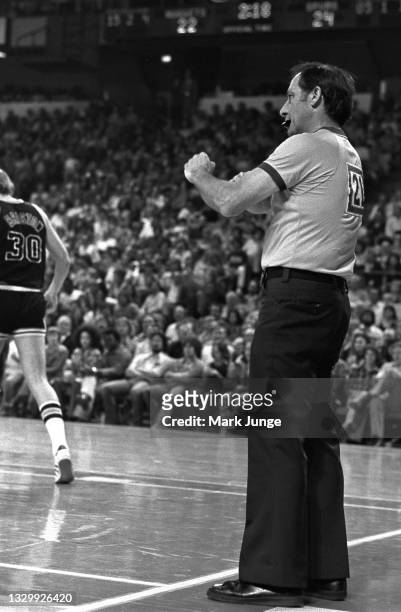 Referee Norm Drucker signals a foul during an NBA basketball game between the Denver Nuggets and San Antonio Spurs at McNichols Arena on March 23,...