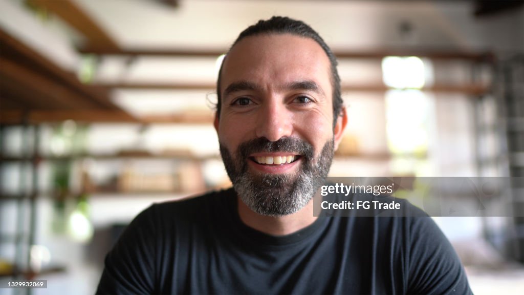 Man doing a video call at home - webcam point of view