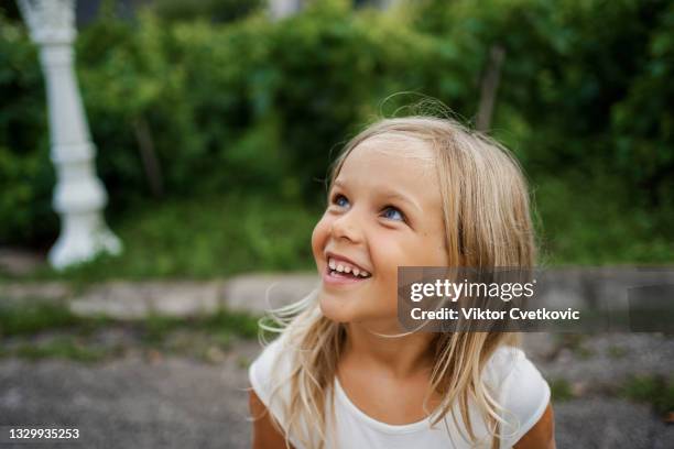 laughing beautiful girl portrait - 6 year old blonde girl stock pictures, royalty-free photos & images