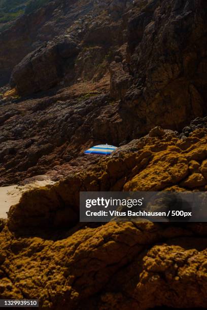 scenic view of rock formation in sea,faro district,portugal - bachhausen stock pictures, royalty-free photos & images