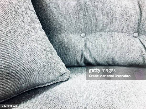 grey sofa - cushion stockfoto's en -beelden