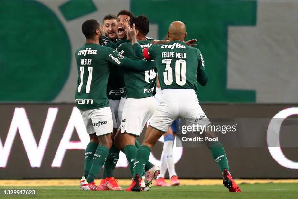 Marcos Rocha of Palmeiras celebrates with teammates after scoring the first goal of his team during a round of sixteen second leg match between...