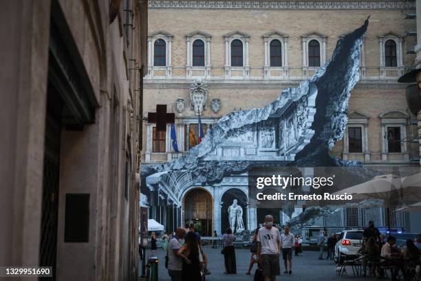 General view during the show of the art installation "Punto di Fuga" by JR on Palazzo Farnese on July 21, 2021 in Rome, Italy. The French street...