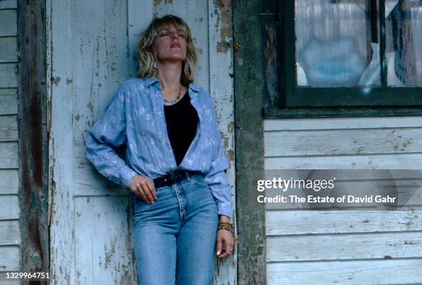 American singer songwriter and musician Lucinda Williams poses for a portrait in July, 1990 in Lenox, Massachusetts.