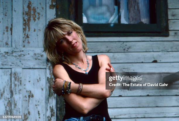 American singer songwriter and musician Lucinda Williams poses for a portrait in July, 1990 in Lenox, Massachusetts.