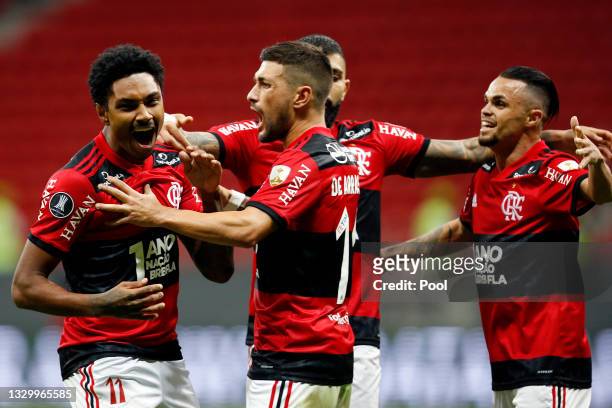 Vitinho of Flamengo celebrates with teammates after scoring the third goal of his team during a round of sixteen second leg match between Flamengo...