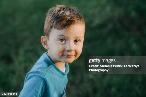 portrait of a 4 years old boy looking at the camera. - 4 5 years stock pictures, royalty-free photos & images