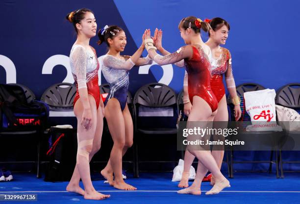 Hitomi Hatakeda, Urara Ashikawa, Yuna Hiraiwa and Aiko Sugihara of Team Japan high five during Women's Podium Training ahead of the Tokyo 2020...