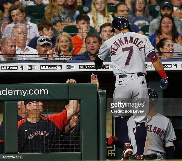 Cesar Hernandez of the Cleveland Indians celebrates in the dugout after hitting a home run in the seventh inning against the Houston Astros at Minute...