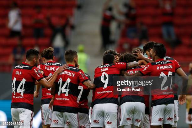 Rodrigo Caio of Flamengo celebrates with teammates after scoring the first goal of his team during a round of sixteen second leg match between...