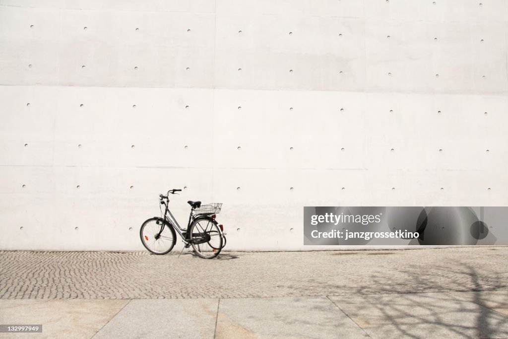 Bike in front of grey wall