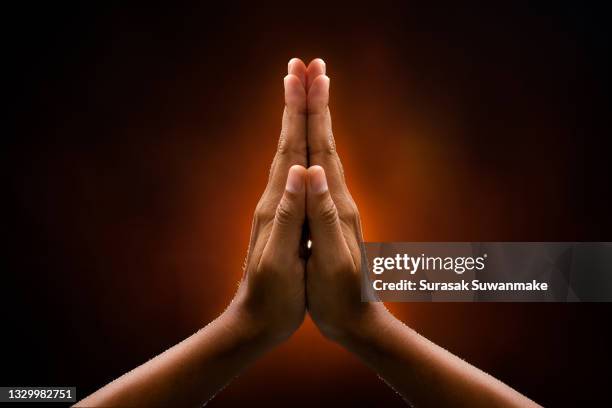 symbols, hands, and religion convey a beautiful bodily faith. - 祈る 手 ストックフォトと画像