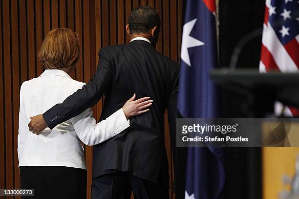 President Barack Obama and Australian PM Julia Gillard leave the Joint Media Conference on the first day of his 2-day visit to Australia, on November...