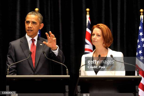 Australian Prime Minister Julia Gillard listens to US President Barack Obama during a Joint Media Conference on the first day of his 2-day visit to...
