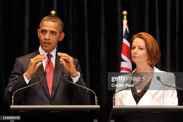 Australian Prime Minister Julia Gillard listens to US President Barack Obama during a Joint Media Conference on the first day of his 2-day visit to...