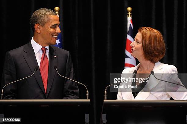 President Barack Obama smiles as he listens to Australian Prime Minister Julia Gillard during a Joint Media Conference on the first day of his 2-day...