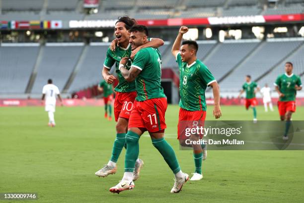 Alexis Vega of Team Mexico celebrates with teammate Carlos Rodriguez after scoring their side's first goal during the Men's First Round Group A match...