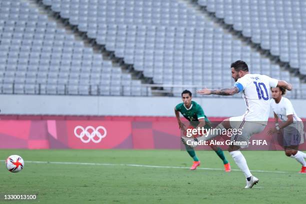 Andre-Pierre Gignac of Team France scores their side's first goal from the penalty spot during the Men's First Round Group A match between Mexico and...