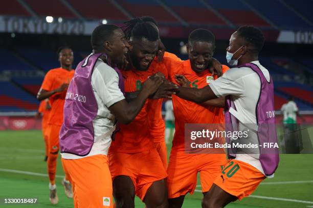 Franck Kessie of Team Ivory Coast celebrates with Max Gradel and team mates after scoring their side's second goal during the Men's First Round Group...