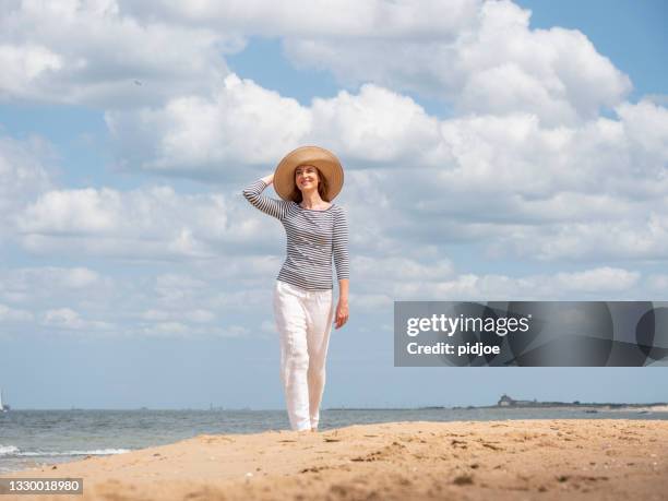 summer by the sea, starting your vacation - mature female models stock pictures, royalty-free photos & images