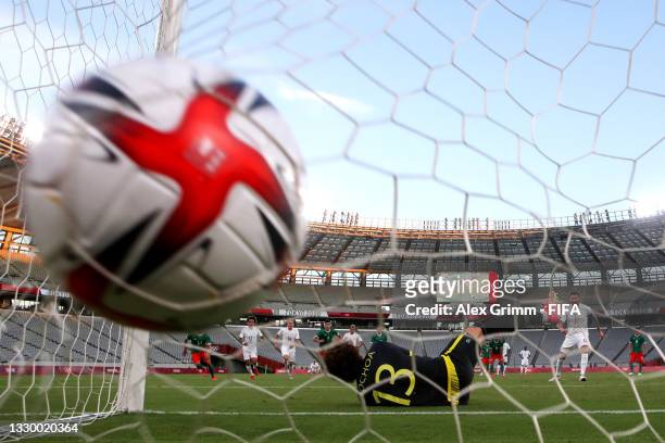 Andre-Pierre Gignac of Team France scores their side's first goal from the penalty spot past Guillermo Ochoa of Team Mexico during the Men's First...