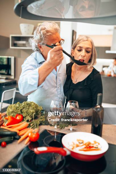 cocinando juntos y degustando vino - couples making passionate love fotografías e imágenes de stock