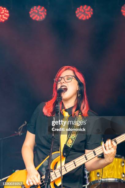 female rock bassist performing live - punk girl stock pictures, royalty-free photos & images