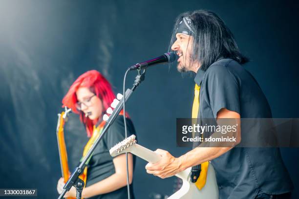 rock band performing live on stage - heavy metal stock pictures, royalty-free photos & images