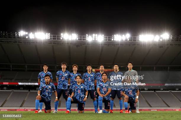Players of Team Japan pose for a team photograph prior to the Men's First Round Group A match between Japan and South Africa during the Tokyo 2020...