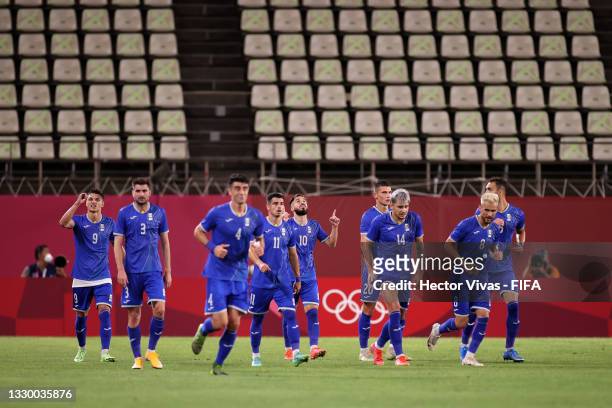 Players of Team Romania celebrate their side's first goal, an own goal by Elvin Oliva of Team Honduras during the Men's First Round Group B match...