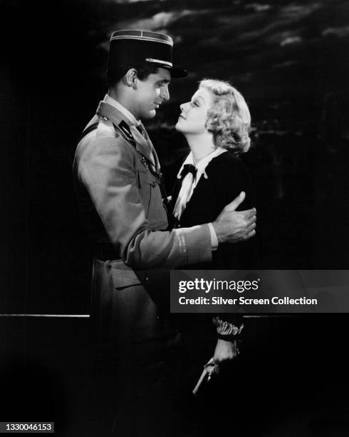 British actor Cary Grant and American actress Jean Harlow on the set of 'Suzy', 1936.