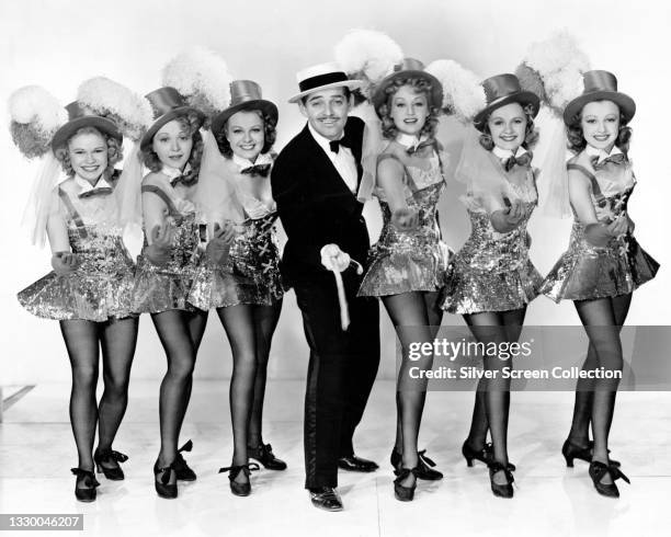 ActorClark Gable as Blackie Norton with cabaret dancers in film 'San Francisco', 1936.