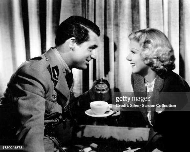 British actor Cary Grant and American actress Jean Harlow on the set of 'Suzy', directed by George Fitzmaurice, 1936.