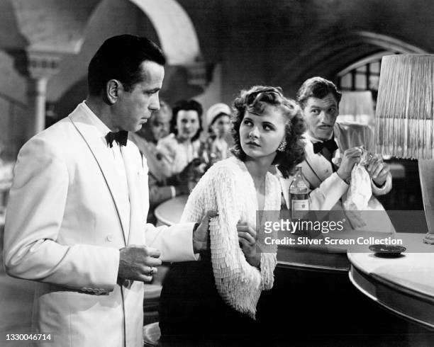 Actors Humphrey Bogart as 'Rick Blaine' and actress Madeleine Lebeau as 'Yvonne' in film 'Casablanca', 1942.