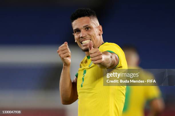 Paulinho of Team Brazil celebrates after scoring their side's fourth goal during the Men's First Round Group D match between Brazil and Germany...