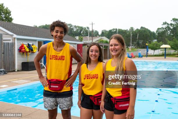 happy teen lifeguards - the lifeguard stock pictures, royalty-free photos & images