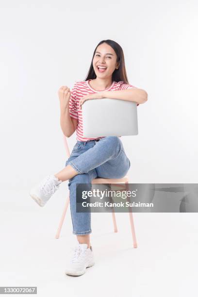 successful young businesswoman - woman excited sitting chair stock pictures, royalty-free photos & images