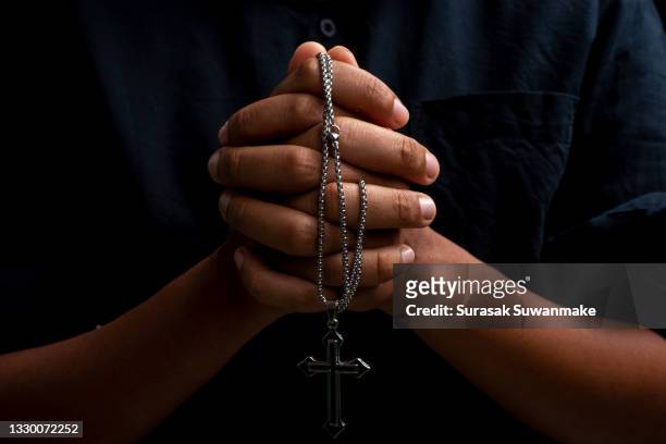 symbols, hands, and religion convey a beautiful bodily faith. - free bible image stock-fotos und bilder