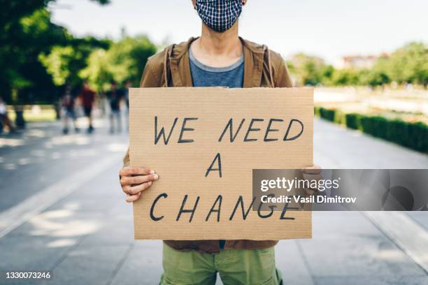 young activist / protester. human rights and social issues concept. - climate change money stock pictures, royalty-free photos & images