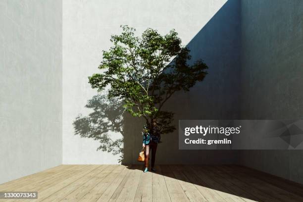 growing tree out of businessman - unexpected stock pictures, royalty-free photos & images