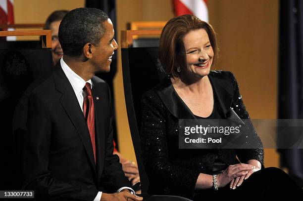 Australian Prime Minister Julia Gillard and US President Barack Obama laugh as he is welcomed to the country before a parliamentary dinner on the...