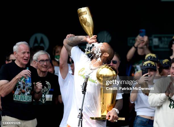 Tucker celebrates with the Larry O'Brien trophy during the Milwaukee Bucks 2021 NBA Championship Victory Parade and Rally in the Deer District of...