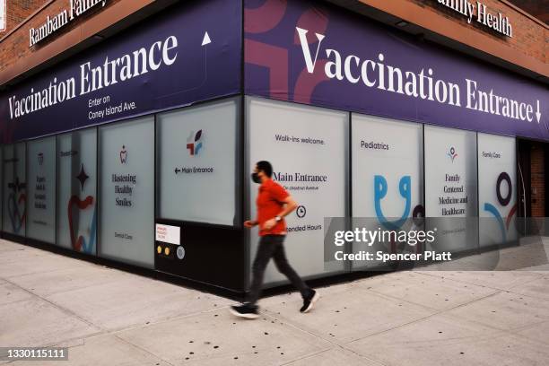 Health center advertises for the Covid-19 vaccine in a neighborhood near Brighton Beach on July 22, 2021 in the Brooklyn borough of New York City....