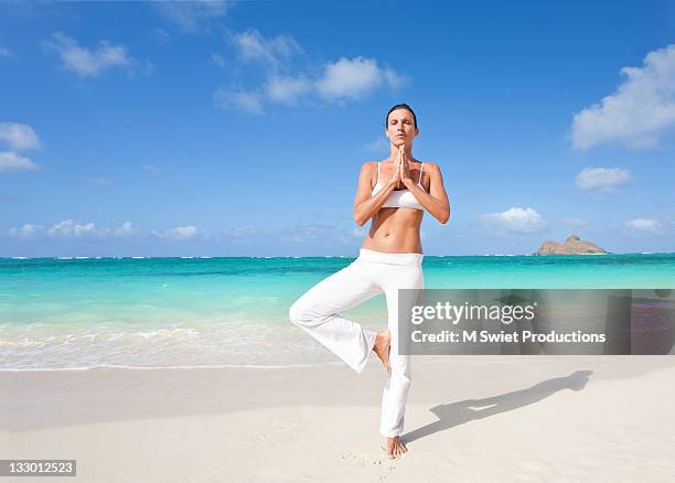 woman doing exercising - lanikai beach stock pictures, royalty-free photos & images