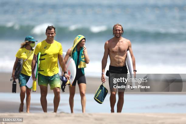 Owen Wright, Julian Wilson and Stephanie Gilmore of Team Australia look on during a practice session at Tsurigasaki Surfing Beach ahead of the Tokyo...