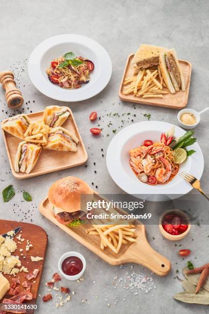 high angle, pasta food with french fries hamburgers and sandwiches - ready meal photos et images de collection